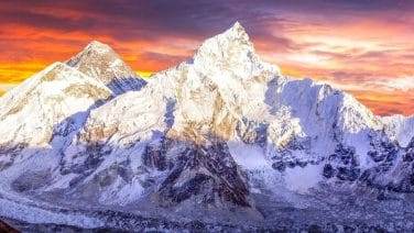 Everest-Base-Camp-trek-with-trekkers-amongst-peaks-and-prayer-flags-reflecting-adventure-and-culture.