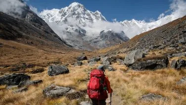 a trekker trekking around beautiful annapurna base camp
