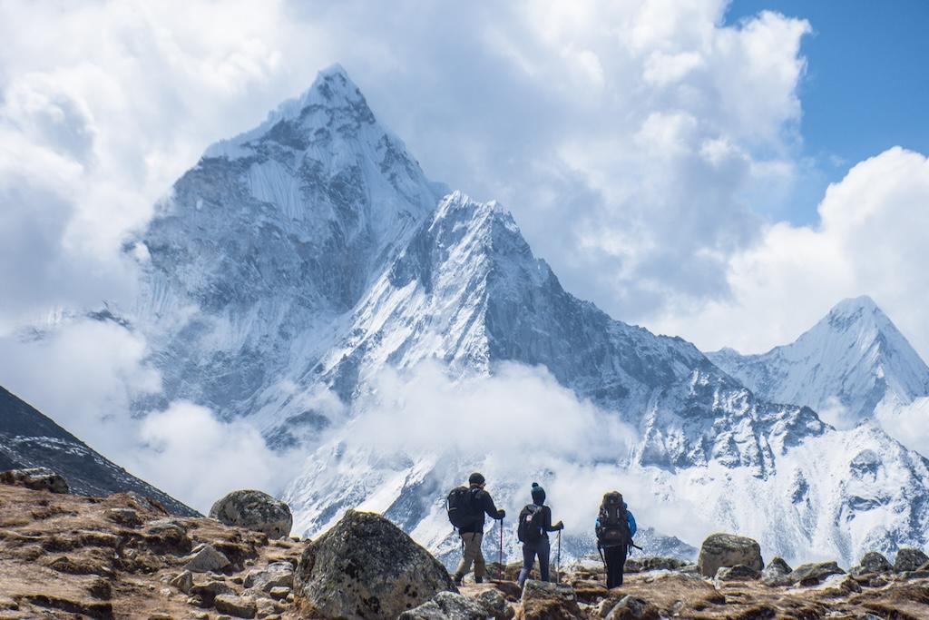 Stunning image of Mount Everest Base Camp with colorful prayer flags and snowy terrain