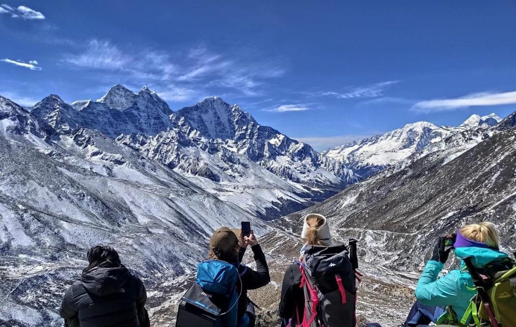 Revamped Everest Base Camp in 2025: trekkers amidst advanced eco-friendly tech at dawn.