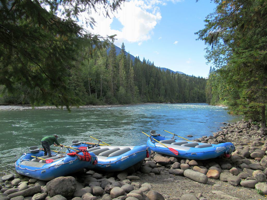 Whitewater rafting team navigating river rapids