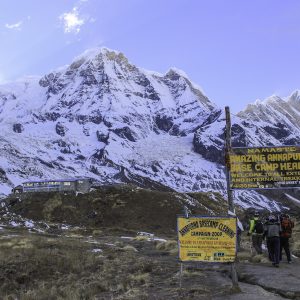 Trekkers approaching Annapurna Base Camp beneath clear November skies