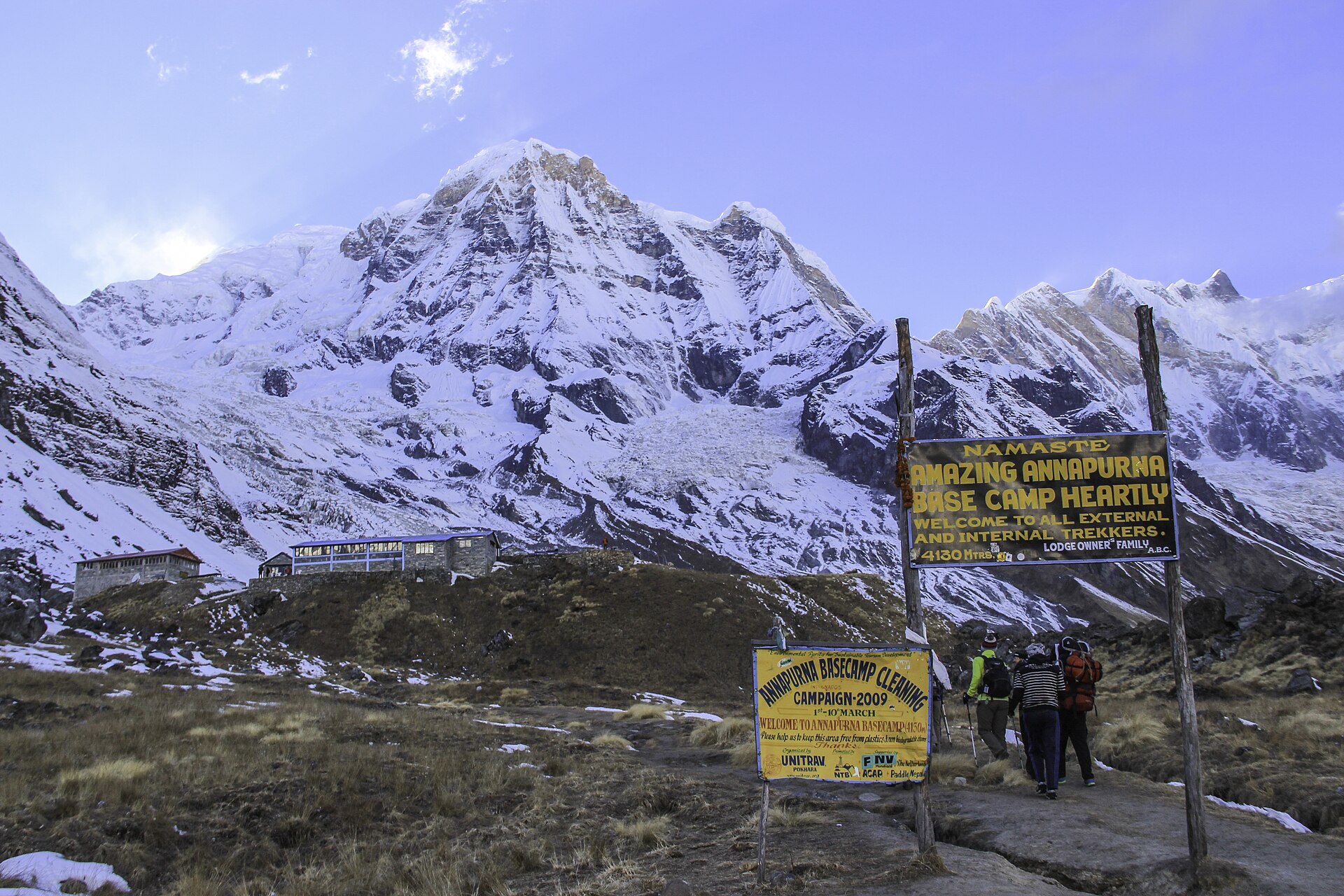 Trekkers approaching Annapurna Base Camp beneath clear November skies
