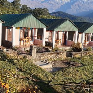 Teahouse rooms with green roofs at Australian Base Camp in Nepal